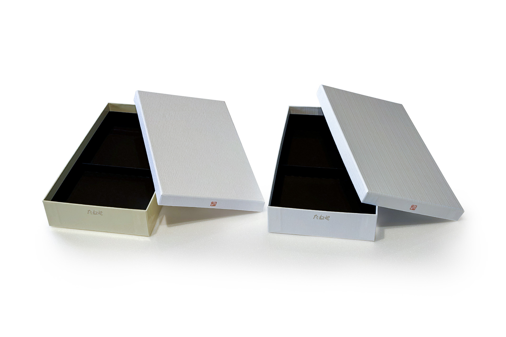 たねや様のパッケージ。左側が旧パッケージで右側が新パッケージ。新パッケージにはバガスシュガーＦが使用されている。